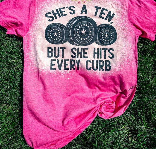 She’s a ten but she hits every curb tee