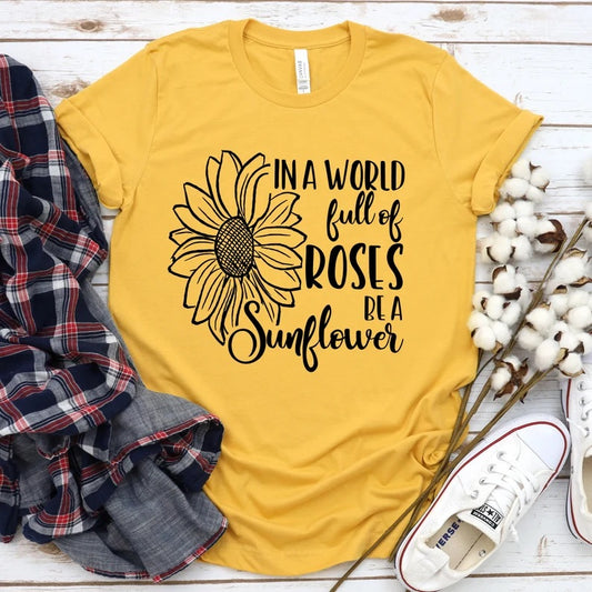 In a world full of roses be a sunflower tee