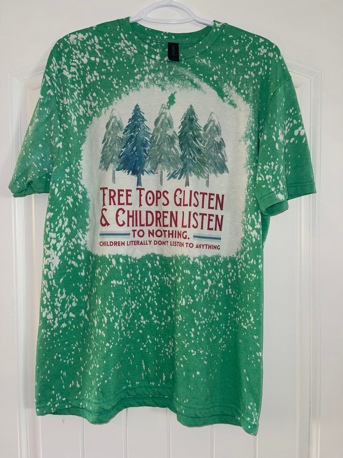 Tree tops glisten and children listen to nothing tee